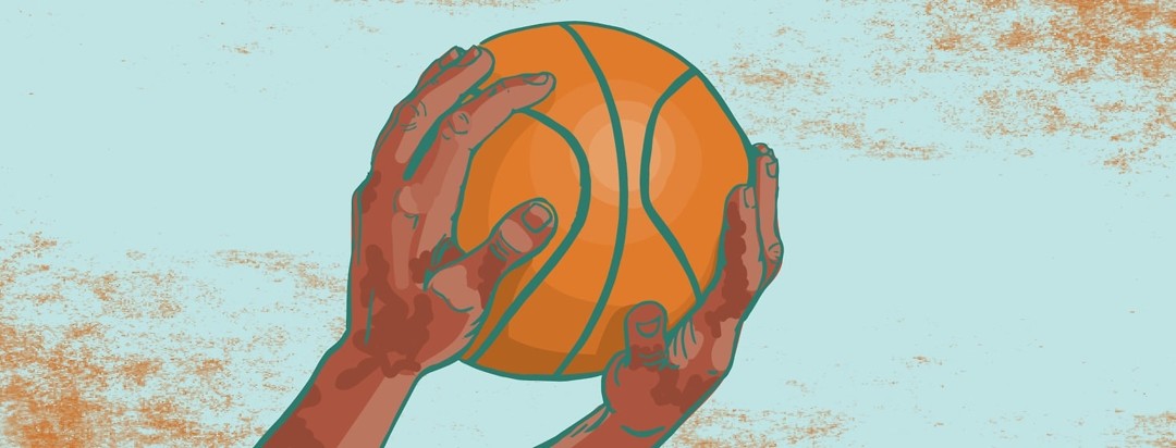 hands with an eczema flare up holding a basketball
