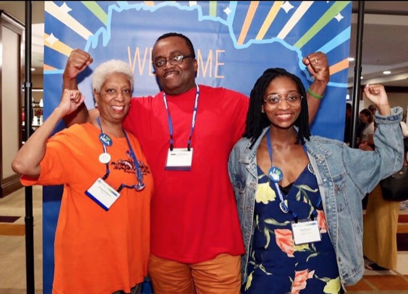 Raelle and her parents posing at Eczema Expo