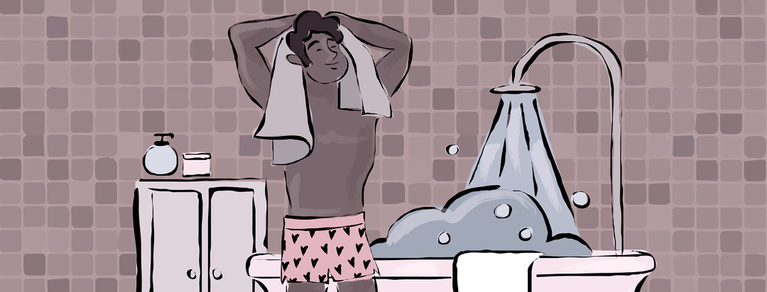 A man towels himself off after a morning shower.
