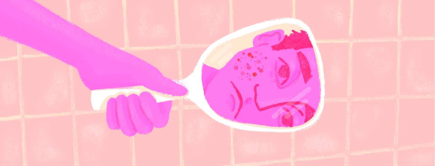 A man looks at his reflection in a handheld mirror with disdain. Eczema is featured prominently on his cheek.