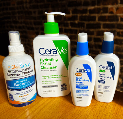 SkinSmart antimicrobial eczema therapy spray next to CeraVe hydrating facial cleanser, CeraVe AM and PM moisturizing lotions
