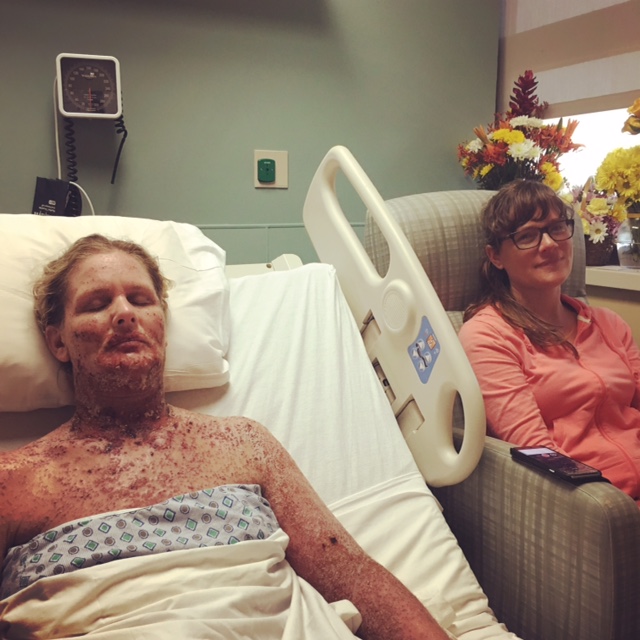 Kelly in hospital bed during Eczema Herpeticum flare sitting with her sister