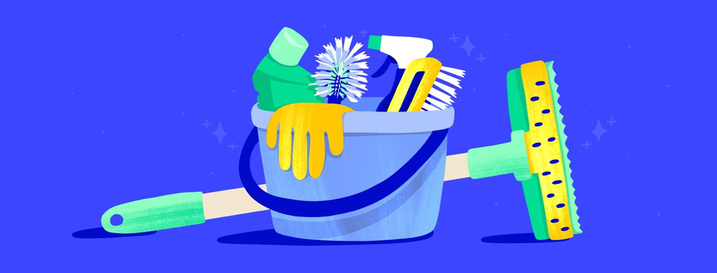 A cleaning bucket filled with cleaning supplies and a mop propped up horizontally behind it.